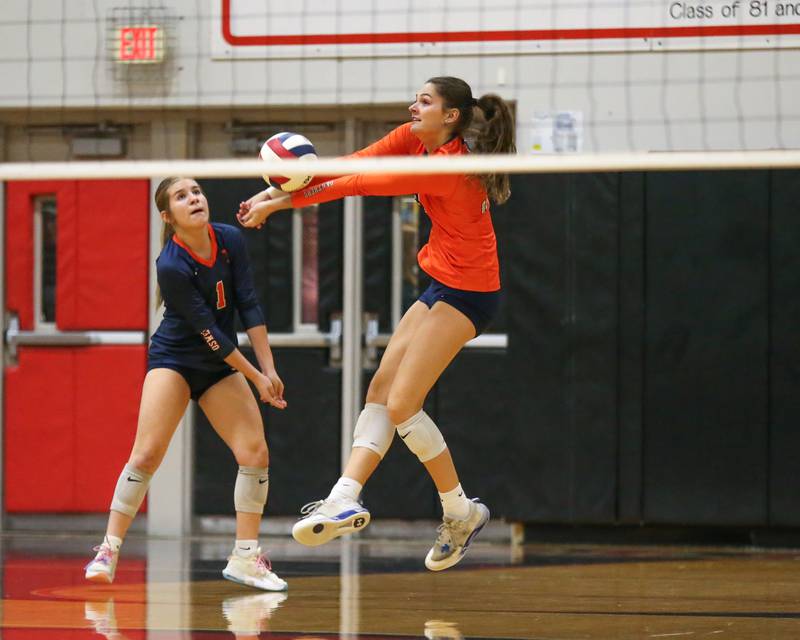 Oswego's Mia Jurkovic (14) bumps the ball during Class 4A Bolingbrook Sectional semifinal match between Joliet West at Oswego.  Nov 5, 2024  in Bolingbrook.
