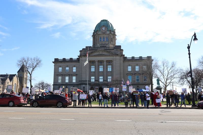 Protesters participate in the No Kings rally at the Kankakee County Courthouse on March 28, 2026.