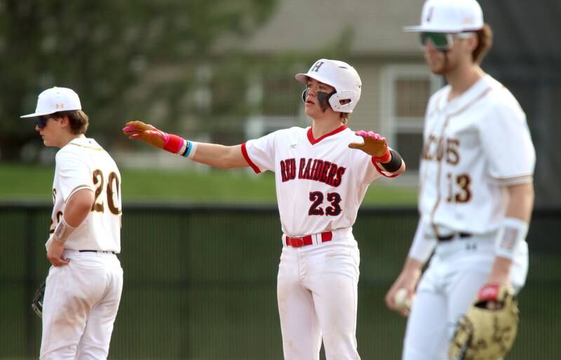 Huntley’s Kyle Larson celebrates a safe landing at second base with a double against Jacobs in varsity baseball Wednesday at Huntley.