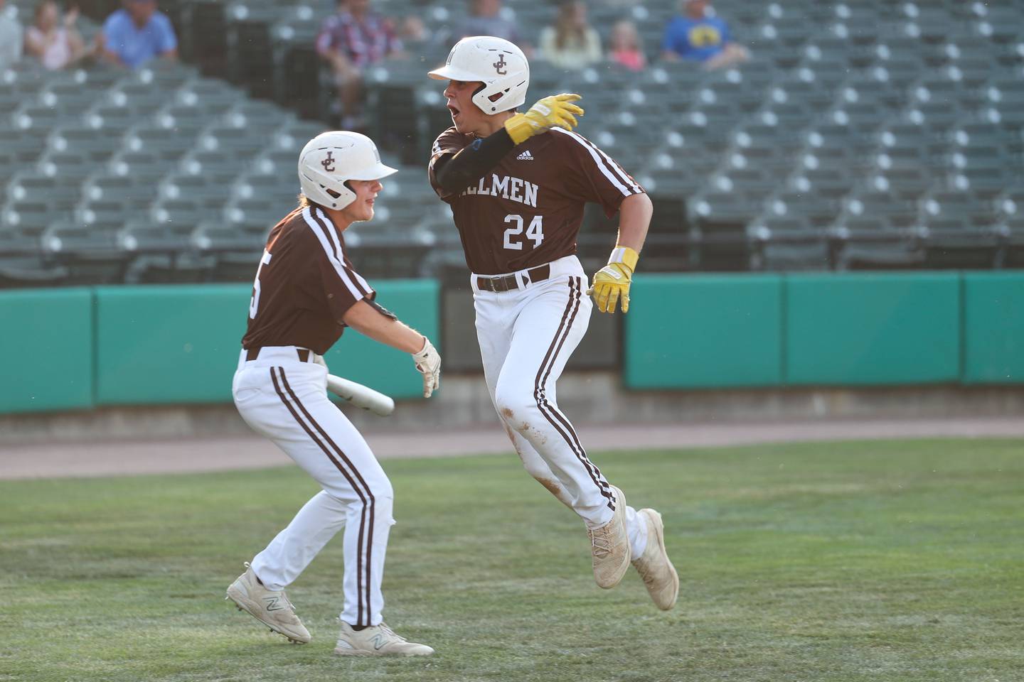 Joliet Catholic’s Vinnie Spotofora, right, celebrates with Graham Roesel after scoring on a wild pitch against Columbia in the IHSA Class 2A State Championship on Saturday, June 3, 2023 in Peoria.