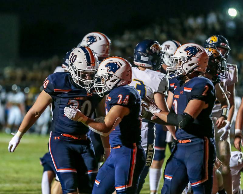 Oswego's Ayden Villa (24) celebrates a touchdown with teammates during a football game between Neuqua Valley and Oswego on Friday, Aug. 30, 2024 in Oswego. Gary E Duncan Sr for Shaw Local News Network.