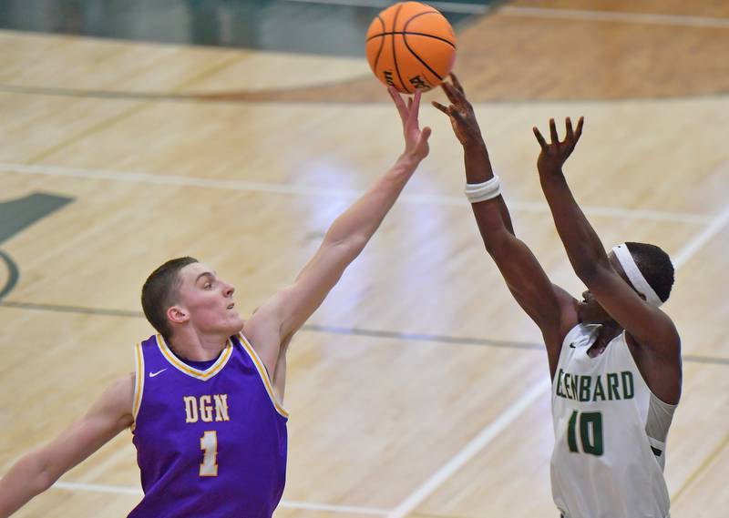 Downers Grove North’s Colin Doyle (1) blocks a shot by Glenbard West’s Josh Abushanab (10) during a game on January 23, 2026 at Glenbard West High School in Glen Ellyn.