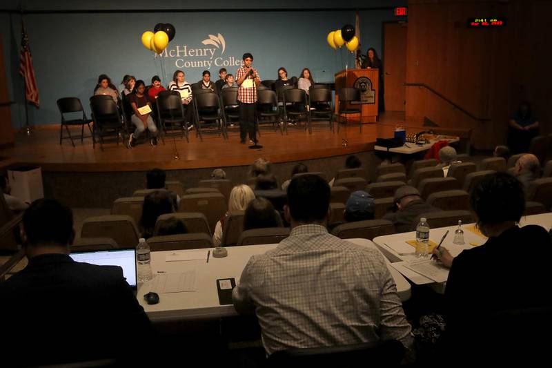 As the Judges watch, Vishrut Kinikar spells word on his way to winning the McHenry County Regional Office of Education 2023 Spelling Bee on Wednesday, March 22, 2023, at McHenry County College's Luecht Auditorium in Crystal Lake.