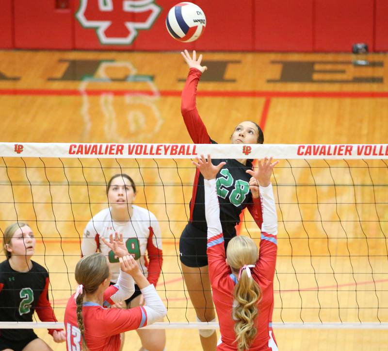 L-P's Ava Currie sends a spike past Ottawa's Ella Damron on Tuesday, Oct. 17, 2023 at Sellett Gymnasium.