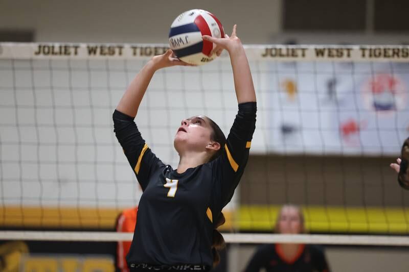 Joliet West’s Lina Govoni sets the ball against Lincoln-Way West on Tuesday, Sept. 12, in Joliet.