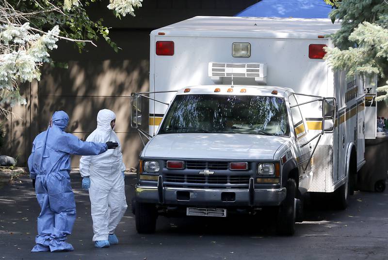 Investigators in front of a home in 5800 block of Wild Plum Road in unincorporated Crystal Lake on Thursday, Aug. 10, 2023, as the McHenry County Sheriff's office continued to investigate the scene where four family members, including three females and a male “aggressor,” were killed Wednesday.