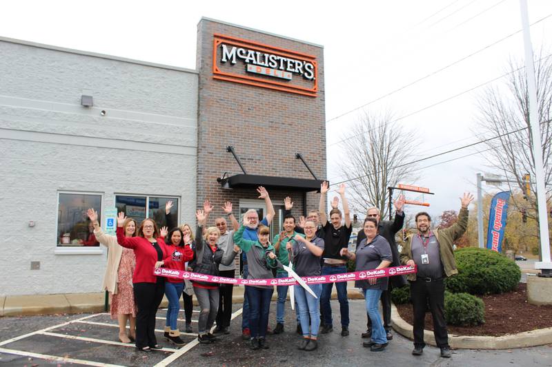 The DeKalb Chamber of Commerce celebrating McAlister's Deli's opening