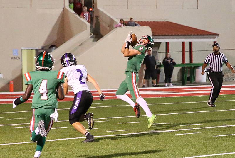 L-P's Seth Adams catches the go ahead touchdown late in the fourth quarter over Plano's Jacob Decker on Friday, Sept. 15, 2023 at Howard Fellows Stadium.