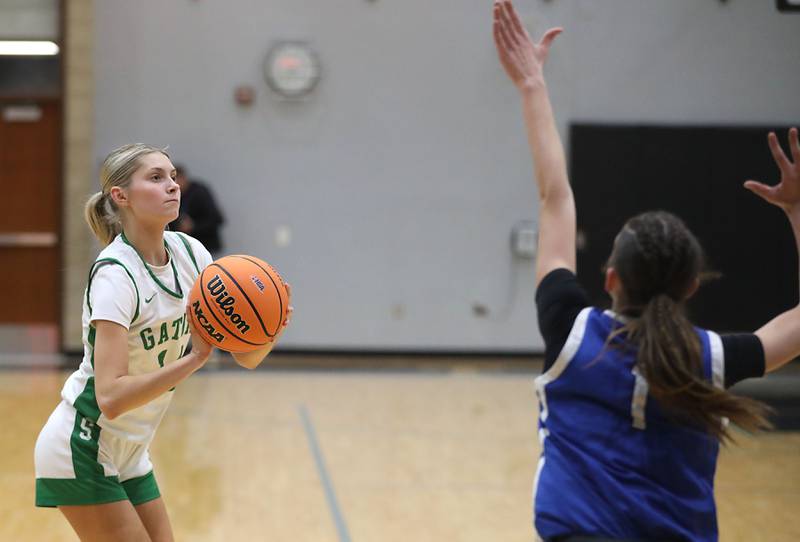 Crystal Lake South's Makena Cleary shoots a three pointer over Woodstock's Alex Nowacki during the IHSA Class 3A Woodstock North Regional championship girls basketball game on Thursday, Feb. 19, 2026, at Woodstock North High School.
