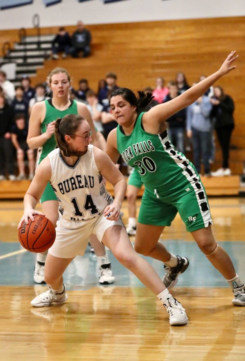 Bureau Valley's Lynzie Cady maneuvers against Rock Falls' Taylor Reyna in Saturday's regional game at the Storm Cellar.