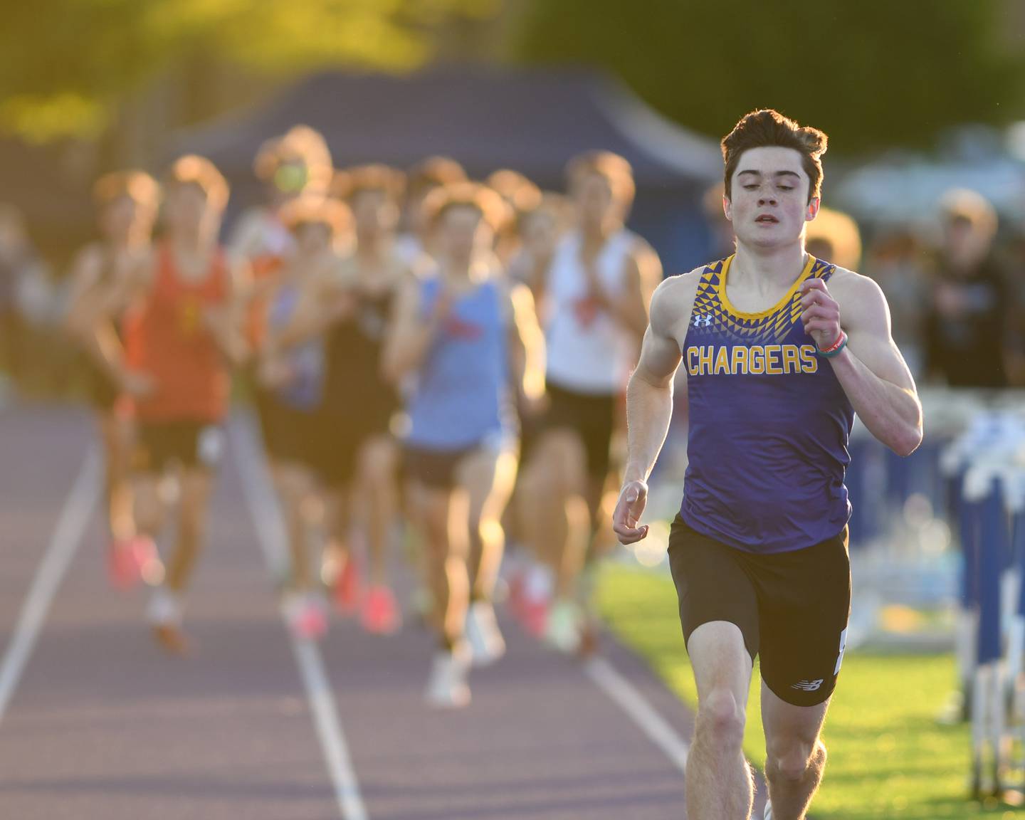 Patrick Hilby of Aurora Central Catholic leeds the first lap of the 2nd heat of the 800 meter run during the Kane County track and field meet held at Marmion Academy in Aurora on Friday May 3, 2024.