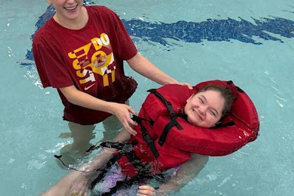 Oswego East parent group donates life vests to help swim class become more inclusive