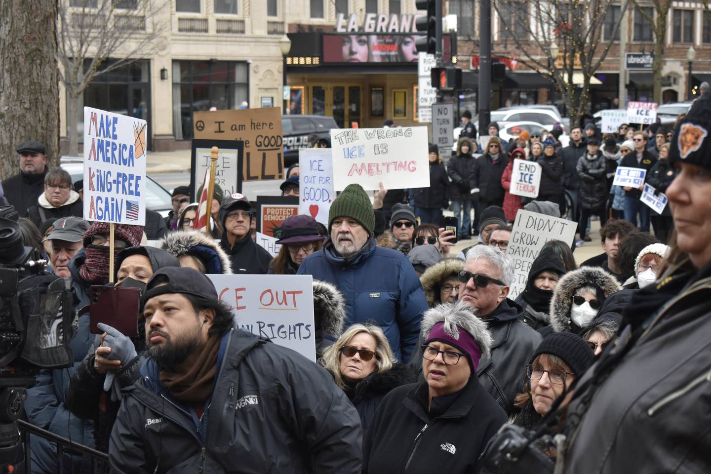 Protestors gather Sunday near the steps of the First Congregational Church of La Grange to hear speakers as part of a demonstration against ICE and the Trump administration. The protestors also walked silently along La Grange Road in memory of Renee Nicole Good