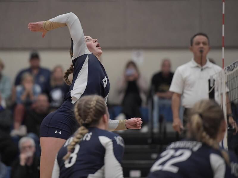 IC Catholic Prep’s Ava Falduto hits at the net against St. Francis in a girls volleyball game in Wheaton on Thursday, October 12, 2023.