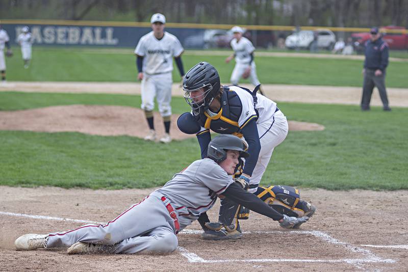 Forreston's Brock Smith is tagged out by Sterling's Blake Nettleton trying to steal home on Monday, May 2, 2022.