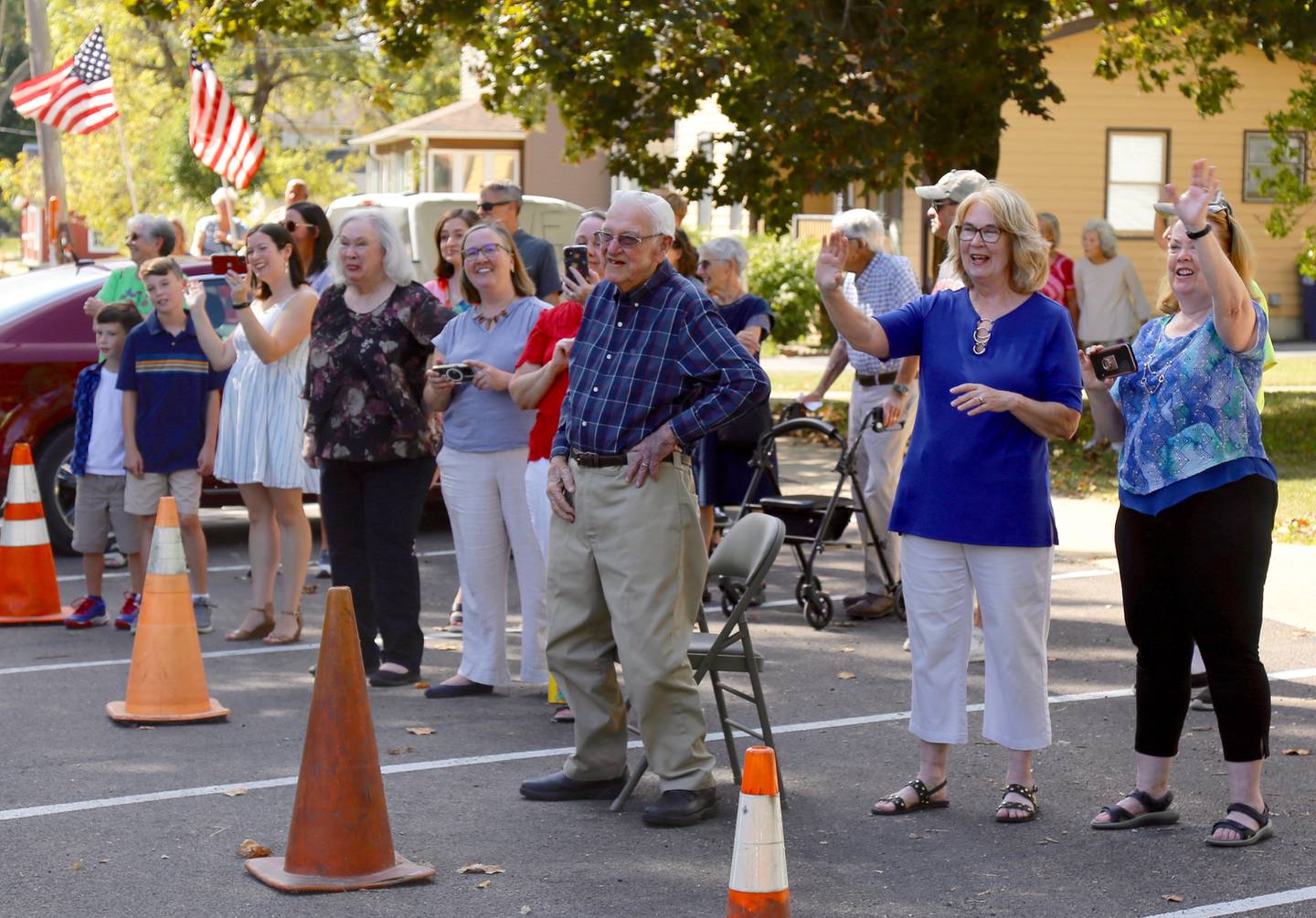 Dave Werdin (center) watches his birthday parade with his family and friends surrounding him that was held in Kaneville on Saturday, Sep. 21, 2024.