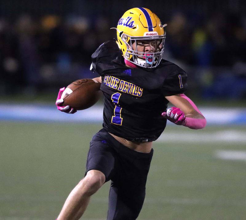 Warren’s Jailen Duffie looks for yardage after a reception against Lake Forest during varsity football Friday, Oct. 22, 2021 in Gurnee.