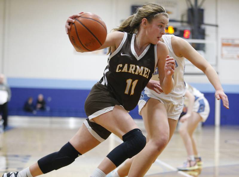 Carmel's Ashley Schlabowske (11) goes baseline during the girls varsity basketball game between Carmel High School and Nazareth Academy on Wednesday, Dec. 7, 2022 in LaGrange, IL.
