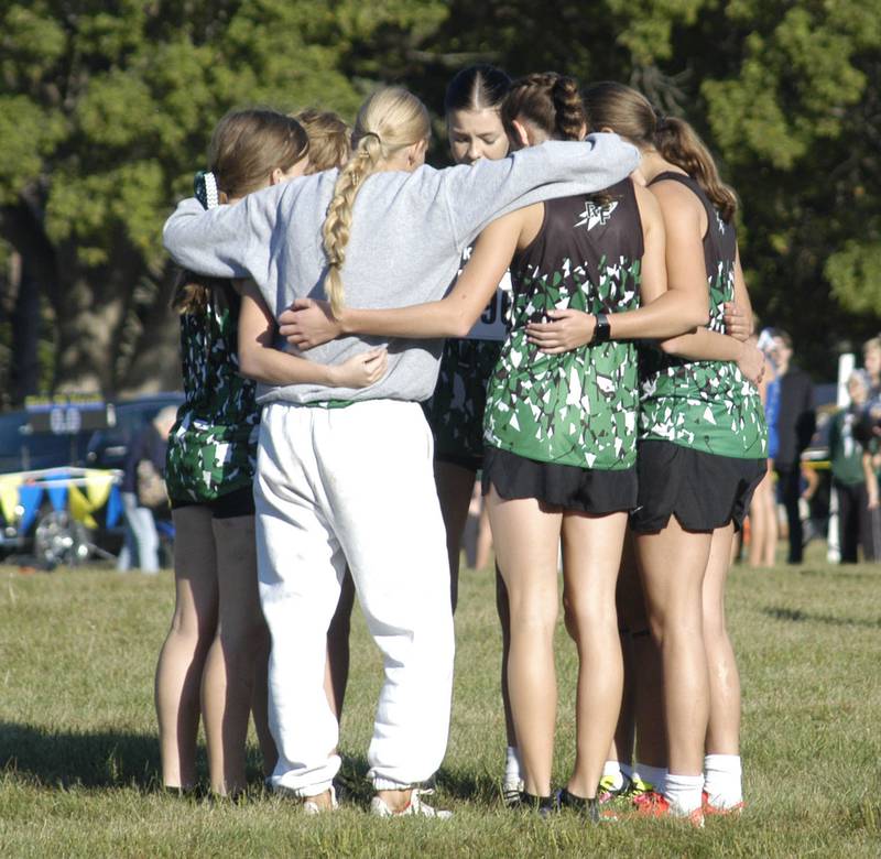 CC runners from Rock Falls get together before the race. Local High School teams gather edat Hoover Park in Sterling for the Rock River Run, held on Saturday, September 27, 2025.