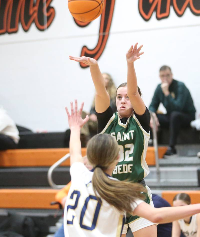 St. Bede's Quinn McClain shoots a jump shot over Marquette's Kaitlyn Davis during the Tri-County Conference championship game on Thursday, Jan. 23, 2025 at Roanoke-Benson High School.