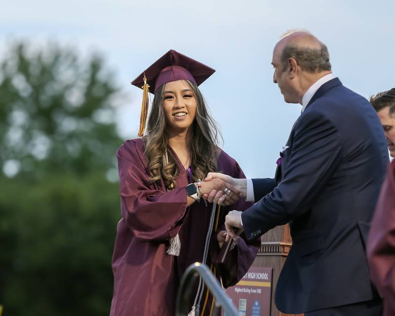 Students receive their diplomas during the Westmont High School graduation ceremony. May 24, 2022