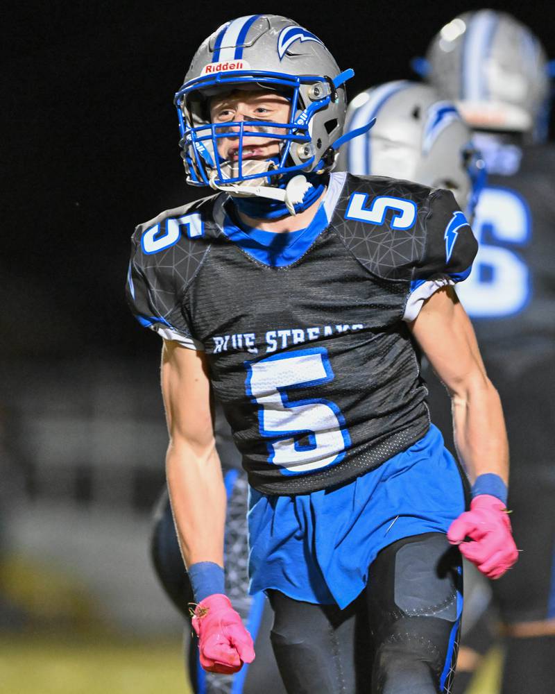 Woodstock's Jared Kay celebrates his interception in the end zone during their game against Kishwaukee River Conference and crosstown rival Woodstock North on Friday, Oct. 25, 2024 at Woodstock H.S.