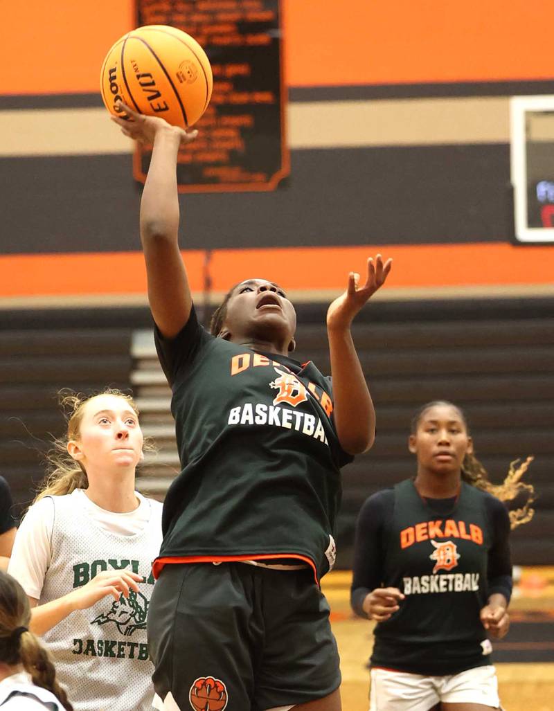 DeKalb’s Kezaria Mitchell gets a shot in the lane during their summer game against Boylan Monday, June 17, 2024, at DeKalb High School.