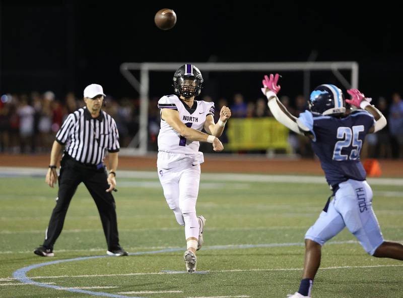 Downers Grove North’s Owen Lansu passes against Downers Grove South during the boys varsity football game on Friday, Sept. 1, 2023.