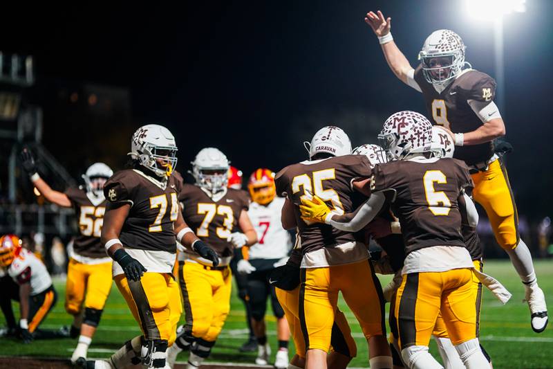 Mt. Carmel players celebrate after scoring a touchdown against Batavia during a class 7A semifinal football playoff game at Mt. Carmel High School in Chicago on Saturday, Nov 18, 2023.