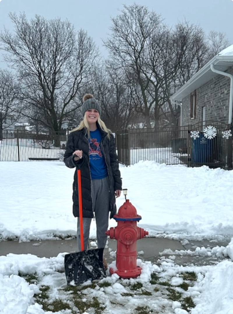 Morris High School student Brooklyn Lind after clearing the fire hydrant near her house.