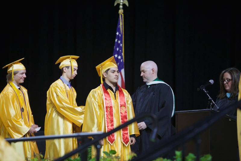 Seniors wait for their diplomas during the Jacobs High School graduation ceremony on May 21, 2022, at the NOW Arena in Hoffman Estates.