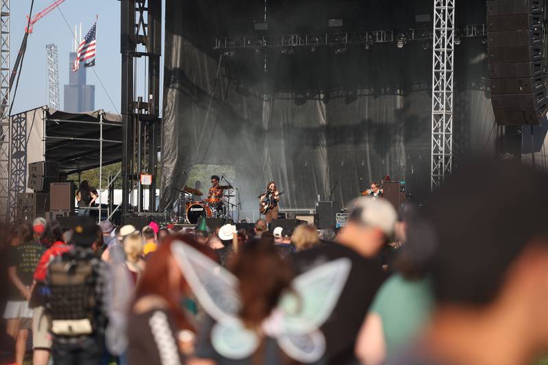 Chicago’s Willis Tower set the backdrop as Ani Difranco performs on the Rise Stage on day one of Riot Fest, Friday, Sept. 15, in Chicago.
