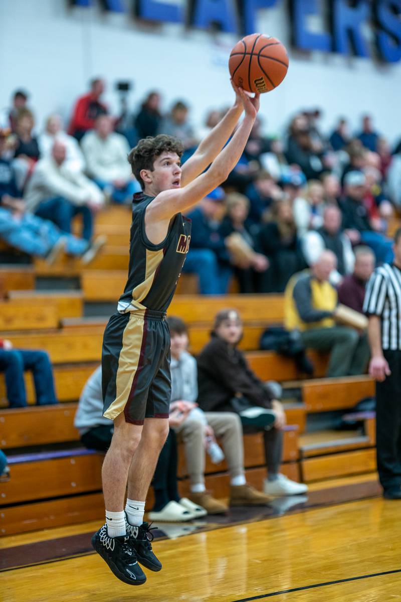 Morris’ Charlie Wright (3) shoots a three-pointer against Marmion during the 59th Annual Plano Christmas Classic basketball tournament at Plano High School on Tuesday, Dec 27, 2022.