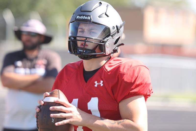 Minooka Quarterback Gavin Dooley looks to pass during practice. Wednesday, Aug. 10, 2022, in Minooka.