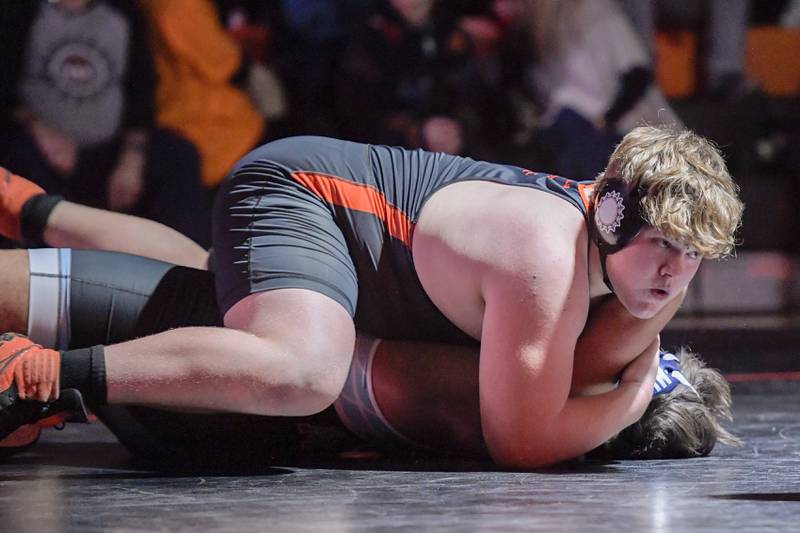 St. Charles East’s Matthew Medina and Marian Central’s George Kordopitoulas wrestle at 285 pounds during a match in St. Charles on Wednesday, December 20, 2023.