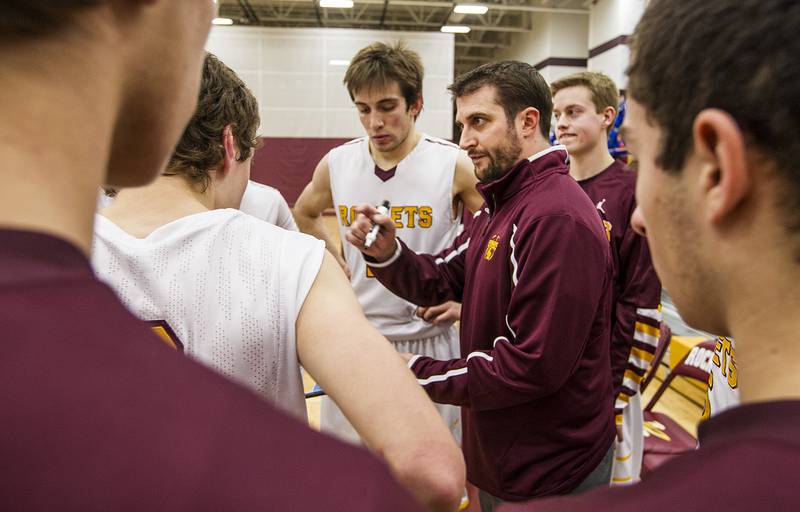 Richmond-Burton head coach Brandon Creason talks with his players during the second quarter of the boys basketball game Friday, January 9, 2015 in Richmond. Richmond-Burton beat Woodstock, 67-57.