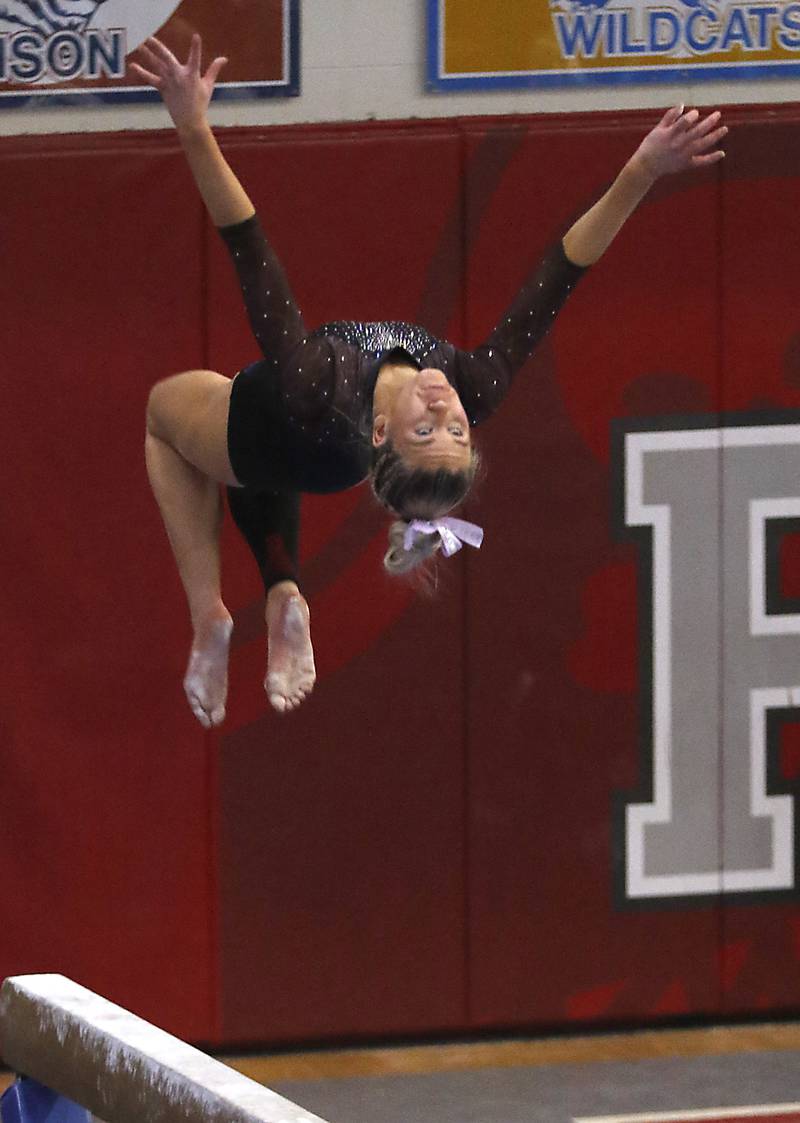 Wheaton Warrenville South’s Haylie Hinkley competes in the preliminary round of the balance beam Friday, Feb. 17, 2023, during the IHSA Girls State Final Gymnastics Meet at Palatine High School.