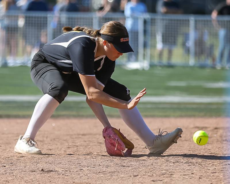 Glenbard North's Tru Medina (34) fields a ground ball during the Class 4A Glenbard West Regional Final softball game between Glenbard North at St Charles North.  May 26, 2023.