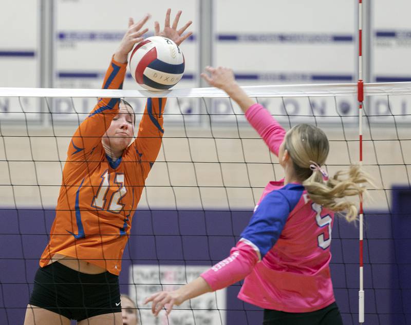 Genoa-Kingston’s Jessie Fredrickson blocks a shot against Dixon’s Morgan Hargrave Thursday, Oct. 17, 2024.