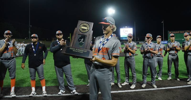 McHenry Brandon Shannon holds the state runner-up trophy  at the conclusion of the Class 4A state baseball title game at Slammers Stadium on Saturday, June 14, 2025 in Joliet.