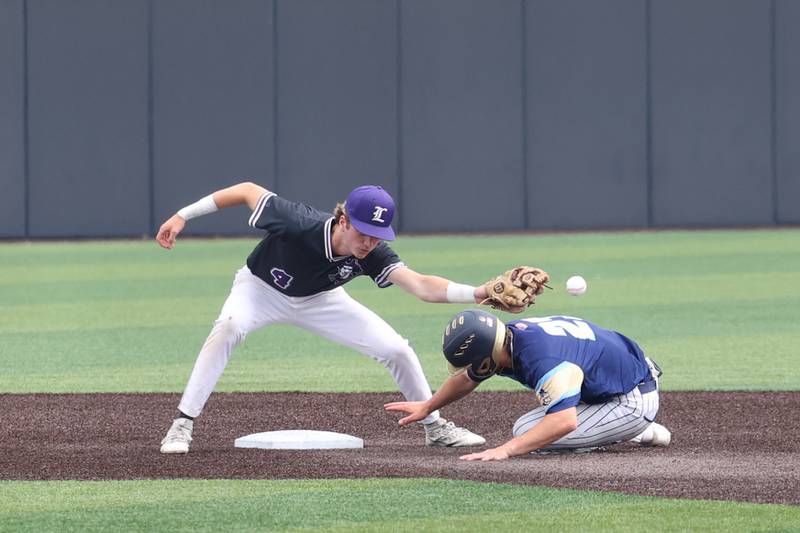 Ottawa Marquette’s Grant Dose slides safely into second as Lexington’s Drake Powell misses the throw during the Crusaders' 16-1 victory over Lexington in the IHSA Class 1A State semifinal on Friday, June 6, 2025.