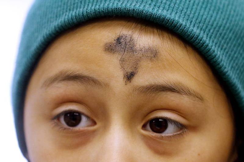Ashes on Ari Perez’s forehead on Wednesday, Feb. 14, 2024, after an Ash Wednesday service at Zion Evangelical Lutheran Church in McHenry,.