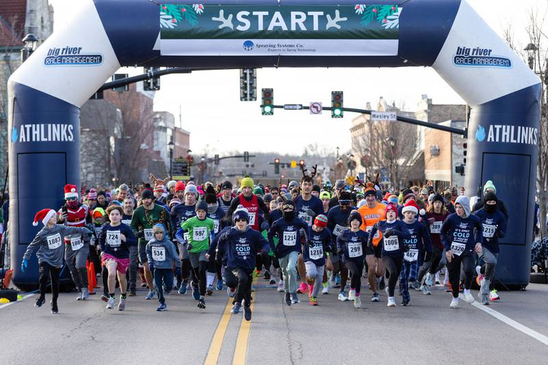 Runners begin the 13th annual Lions Charities Reindeer Run 5K Wheaton on Saturday, Dec. 7, 2024.