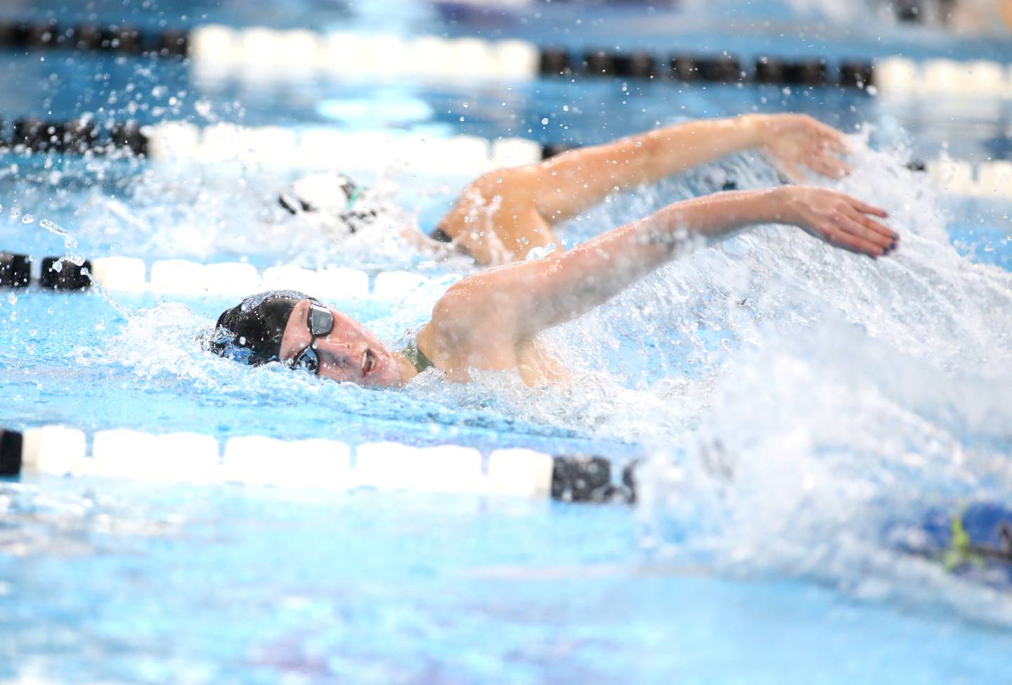 St. Charles North’s Avery Luedke competes in the 500-yard freestyle championship heat during the IHSA Girls State Championships on Saturday, Nov. 16, 2024 at FMC Natatorium in Westmont.