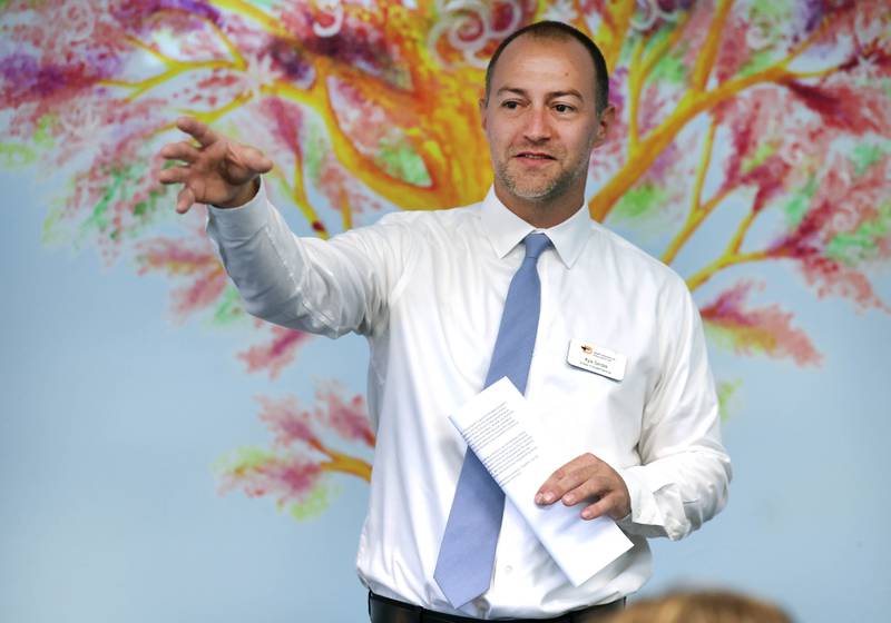 Kyle Gerdes, director of student services for DeKalb School District 428, talks about the plans for the new transition program facility Friday, Aug. 9, 2024, during the Beyond One Barb Transition Center Construction Kick-Off event at the new site at 530 Charter St. in DeKalb.