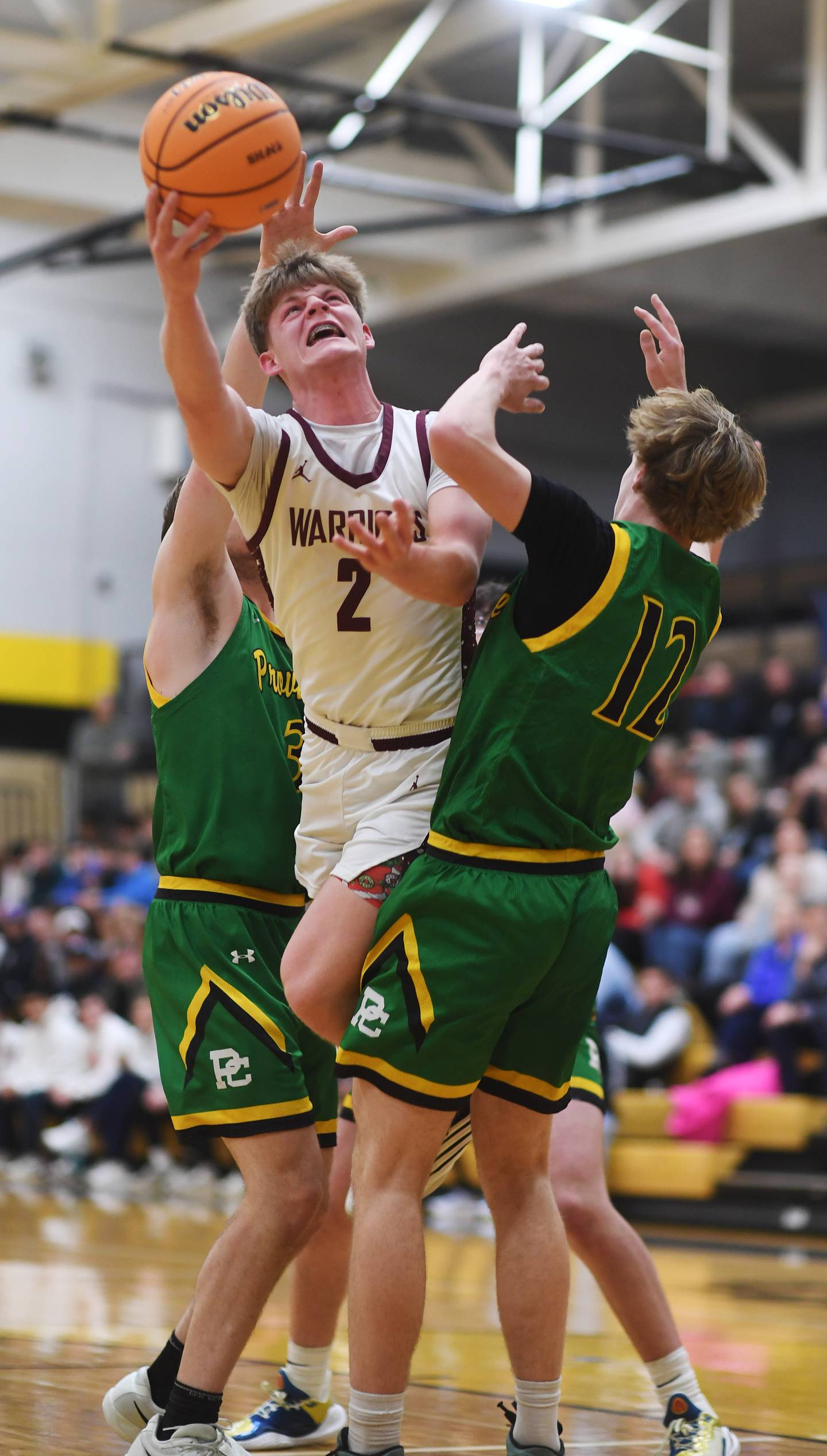 Wheaton Academy's Tyler Anderson tries to make a move to the basket between Providence's Reece Kras, right, and Luke Rost, but he was called for a charging foul during the Class 3A Hinsdale South boys basketball sectional semifinal in Darien Wednesday.