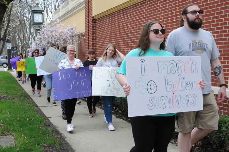 Walkers make their way throughout downtown Ottawa on Saturday, April 23, 2022, during Safe Journeys March to Believe. Safe Journeys offers a safe atmosphere for survivors of domestic and sexual violence and can provide support resources and strength.