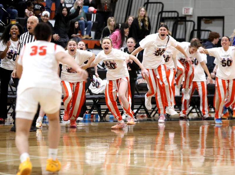 St. Charles East players storm the floor following their win over St. Charles North on Friday, Jan. 31, 2025 at St. Charles East.