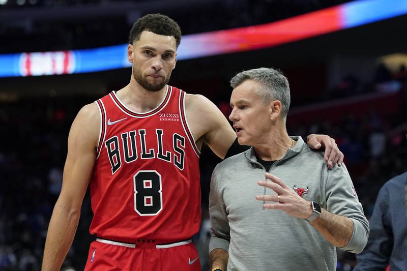Chicago Bulls guard Zach LaVine (8) walks off the court with head coach Billy Donovan after the second half of an NBA basketball game against the Detroit Pistons, Wednesday, Oct. 20, 2021, in Detroit. (AP Photo/Carlos Osorio)