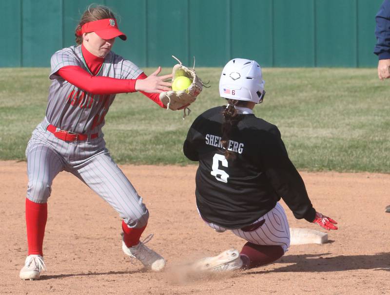 Morris's Devin Shenberg slides safely into second base as L-P's short shop Kelsey Frederick misses the tag on Monday, April 7, 2025 at the L-P Athletic Complex in La Salle.